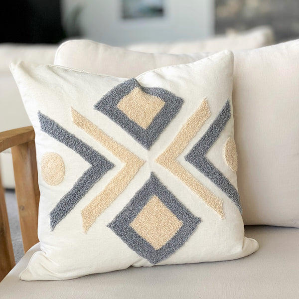 Striking blue and cream aztec design cushion.