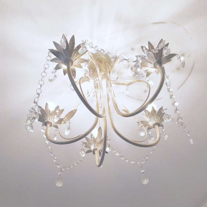 shabby chic chandelier with leaf design installed