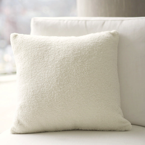 White Boucle Cushion: A soft and textured cushion featuring boucle fabric in a french white color, perfect for adding elegance, comfort, and versatility to any seating or bedding arrangement.